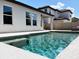 Sparkling swimming pool offers a refreshing oasis with clear blue water, surrounded by well-maintained concrete at 15071 Guava Bay Dr, Winter Garden, FL 34787