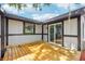 Back deck with sliding glass door access and views of the lush backyard. Ideal for entertaining at 18015 Beach St, Umatilla, FL 32784