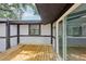 Wooden back deck features sliding glass door access to the kitchen and views of the backyard at 18015 Beach St, Umatilla, FL 32784