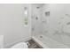 Renovated bathroom with a tiled shower and a decorative niche at 18015 Beach St, Umatilla, FL 32784