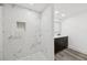 Renovated bathroom with tiled shower and black vanity with white countertop at 18015 Beach St, Umatilla, FL 32784