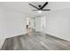 Bedroom with view to game room and sliding glass doors to porch at 18015 Beach St, Umatilla, FL 32784
