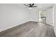 Bedroom with view to game room and sliding glass doors to porch at 18015 Beach St, Umatilla, FL 32784