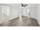 Bright room with gray flooring, fresh white paint, and view to bathroom at 18015 Beach St, Umatilla, FL 32784