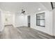 Bright living room featuring updated flooring, fresh paint, and abundant natural light at 18015 Beach St, Umatilla, FL 32784