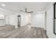Light and airy living space with modern flooring, recessed lighting, and a ceiling fan at 18015 Beach St, Umatilla, FL 32784