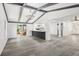 Open-concept living area with exposed beam ceiling and new flooring, perfect for entertaining at 18015 Beach St, Umatilla, FL 32784