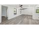 Bright and airy living space with gray wood-look flooring with open concept layout at 18015 Beach St, Umatilla, FL 32784