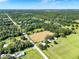 Aerial view of the property with surrounding lush Florida landscape at 187 N Samsula Dr, New Smyrna Beach, FL 32168