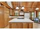 Well-equipped kitchen featuring wood cabinets, white countertops, and modern appliances at 187 N Samsula Dr, New Smyrna Beach, FL 32168