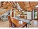 Bright living area offering exposed beams, vaulted ceilings, an open floor plan and staircase at 187 N Samsula Dr, New Smyrna Beach, FL 32168