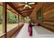 Extended screened porch offering ample space, wood finishes, and great outdoor views at 187 N Samsula Dr, New Smyrna Beach, FL 32168