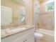 Bathroom with granite countertop, tiled shower and bathtub at 1889 15Th St, Orange City, FL 32763