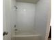 Bathroom with white tile walls and tub at 199 Afton Sq # 108, Altamonte Springs, FL 32714