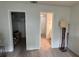 A clean bedroom with wood floors offers views of the closet and bathroom at 199 Afton Sq # 108, Altamonte Springs, FL 32714
