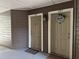Condo entryway showcases unit doors 107 and 108 with welcome mats and decorative exterior fixtures at 199 Afton Sq # 108, Altamonte Springs, FL 32714