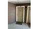 Close-up of condo door 108 with a door mat and decorative exterior lighting fixture at 199 Afton Sq # 108, Altamonte Springs, FL 32714