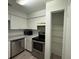 Bright kitchen with stainless steel appliances and pantry at 199 Afton Sq # 108, Altamonte Springs, FL 32714