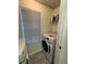 Laundry room with white washer and dryer and window for natural light at 199 Afton Sq # 108, Altamonte Springs, FL 32714