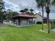 Mail kiosk on a lush green lawn, near clubhouse, with palm trees in the background at 199 Afton Sq # 108, Altamonte Springs, FL 32714