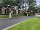 Well-maintained street view with lush green grass, trees, and buildings in the background at 199 Afton Sq # 108, Altamonte Springs, FL 32714