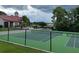 Community tennis court with a well-maintained green surface and black chain-link fence at 199 Afton Sq # 108, Altamonte Springs, FL 32714