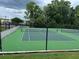 Community tennis courts with well-maintained green surfaces and black chain-link fences at 199 Afton Sq # 108, Altamonte Springs, FL 32714