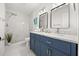 Stylish bathroom with dual sinks, marble counters and a walk-in shower at 2089 Sunderland Rd, Maitland, FL 32751