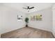 Empty bedroom with ceiling fan, wood floors, and large windows at 2089 Sunderland Rd, Maitland, FL 32751