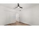 Bright bedroom features new hardwood floors, closet, and updated ceiling fan at 2089 Sunderland Rd, Maitland, FL 32751