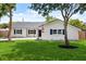 Charming one-story home with a well-kept lawn, new driveway, and blue shutters at 2089 Sunderland Rd, Maitland, FL 32751