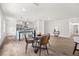 Open-concept kitchen and living area, features hardwood flooring, and an island with barstool seating at 2089 Sunderland Rd, Maitland, FL 32751