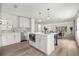 Bright and open concept kitchen features a kitchen island, stainless steel appliances, and a dining area at 2089 Sunderland Rd, Maitland, FL 32751