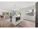 Bright, open kitchen, features an island with a built-in microwave and stainless steel appliances at 2089 Sunderland Rd, Maitland, FL 32751