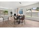 Open-concept dining and living area, features hardwood flooring, neutral paint palette, and lots of natural light at 2089 Sunderland Rd, Maitland, FL 32751