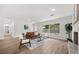Open-concept living area, features hardwood flooring, neutral paint palette, fireplace, and lots of natural light at 2089 Sunderland Rd, Maitland, FL 32751