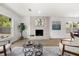 Open concept living room with fireplace feature, hardwood flooring, and neutral paint palette at 2089 Sunderland Rd, Maitland, FL 32751