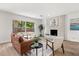 Light and bright living room with fireplace feature, hardwood flooring, and furniture at 2089 Sunderland Rd, Maitland, FL 32751