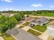 Overhead view of homes featuring well-maintained lawns, driveways, and proximity to green areas at 2181 Jessa Dr, Kissimmee, FL 34743