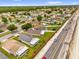 Aerial view of a residential area showcasing various homes, roads, and proximity to major highway at 2181 Jessa Dr, Kissimmee, FL 34743