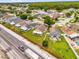Aerial shot of a neighborhood near a road, with multiple houses and green spaces visible at 2181 Jessa Dr, Kissimmee, FL 34743
