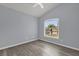 Bright bedroom featuring a view of the front yard through a large window at 2181 Jessa Dr, Kissimmee, FL 34743