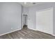 Neutral bedroom with wood floors and closet, and doorway to an ensuite bathroom at 2181 Jessa Dr, Kissimmee, FL 34743