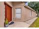 Charming home exterior with a traditional-style front door and landscaped walkway at 2181 Jessa Dr, Kissimmee, FL 34743