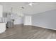 Spacious living room with light gray floors leading to kitchen and front door at 2181 Jessa Dr, Kissimmee, FL 34743