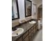 Well-maintained bathroom featuring a double sink vanity and tiled flooring at 2320 Ne 43Rd St, Ocala, FL 34479