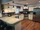 Modern kitchen featuring stainless steel appliances, granite countertops, and ample cabinet space at 2320 Ne 43Rd St, Ocala, FL 34479