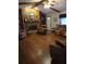 Cozy living room with a stone fireplace, hardwood floors and comfortable seating at 2320 Ne 43Rd St, Ocala, FL 34479