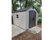 Durable and stylish outdoor shed with double doors and clean landscaping at 2320 Ne 43Rd St, Ocala, FL 34479