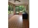 Bright and airy sunroom with tile flooring, perfect for relaxation or entertaining at 2320 Ne 43Rd St, Ocala, FL 34479